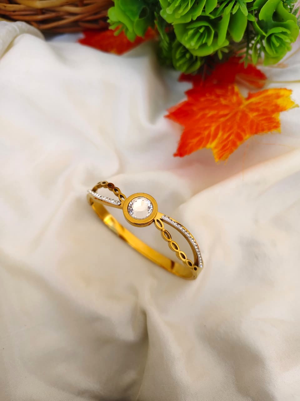 High-shine stone-encrusted bracelet with brilliant clear gemstones in a silver-tone setting.