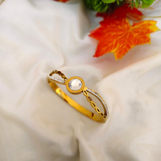 High-shine stone-encrusted bracelet with brilliant clear gemstones in a silver-tone setting.
